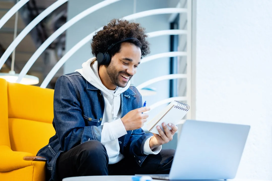 A diverse team collaborating on digital marketing strategies at a desk, using laptops and tablets.